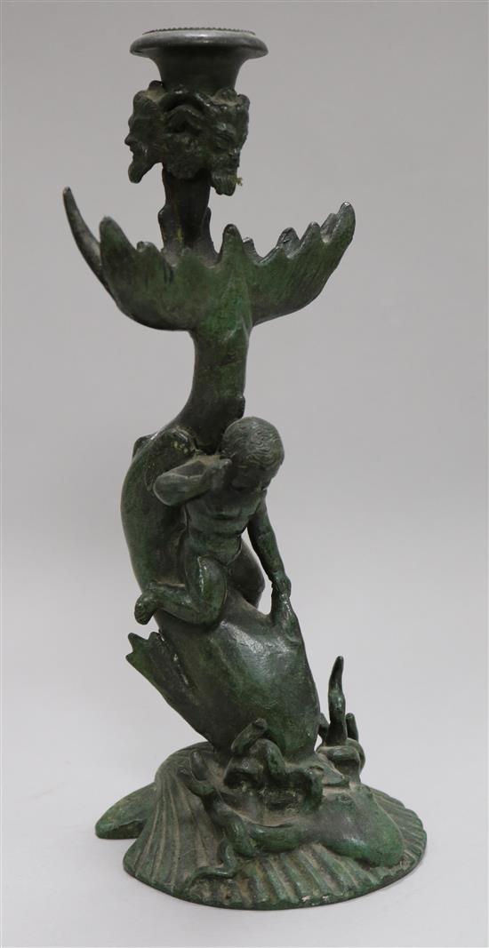 A bronze cherub and dolphin candlestick 26cm